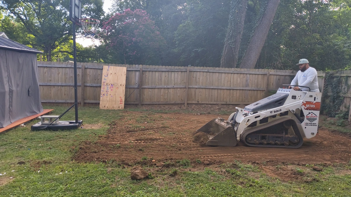 Aerial view of a freshly poured concrete driveway on a Charlotte home