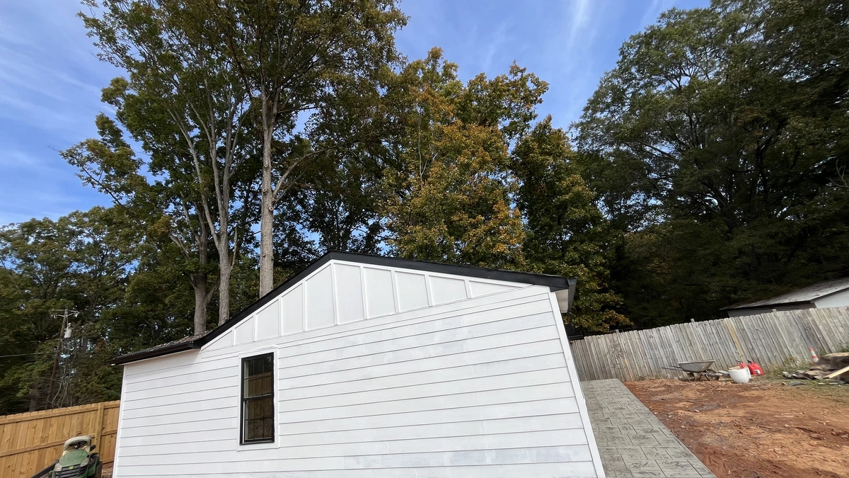 Aerial view of a freshly poured concrete driveway on a Charlotte home